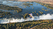 Tourists fly over the Victoria Falls on the trikes. Africa. Zamb