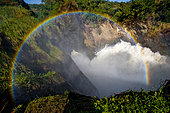 Murchison Falls. Top view of the water stream with a beautiful rainbow. Uganda. East Africa.