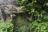Composting area for grass clippings in the garden