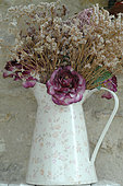 Bouquet of dried flowers in an iron pot