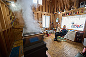 Traditional wood-fired boiler in a sugar shack at sugar time, Saint-Barthélemy, Lanaudière, Quebec, Canada