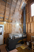 Traditional wood-fired boiler in a sugar shack at sugar time, Saint-Barthélemy, Lanaudière, Quebec, Canada