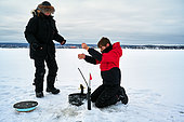 Ice fishing or White fishing, Lake Saint Jean, Saguenay lac St Jean region, Province of Quebec, Canada