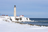 Cap-des-Rosiers lighthouse in winter at the mouth of the St. Lawrence, Gaspé, Quebec, Canada