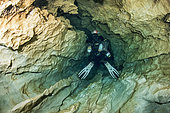 Underground diver descending into the first well of the Buèges spring, Hérault, France