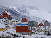 Little Inuit village Tinit (Tiilerilaaq) at the shore of the Sermilik (Sermiligaaq) icefjord in the area Ammassalik in East Greenland. North America, Greenland, Ammassalik, Danish territory, autumn