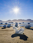 Melting ice on shore. Landscape at the Sermilik (Sermiligaaq) icefjord in the area Ammassalik in East Greenland. North America, Greenland, Ammassalik, Danish territory, autumn