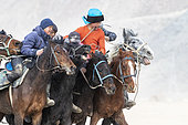 Riders at a game of Kok-boru (or Ulak-tartish or Buzkachi), Central Asian equestrian games at the Noorus festival, Kotchkor, Naryn Region, Kyrgyzstan