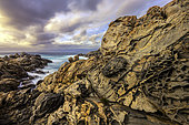 The Pointe de Campomoro in a strong westerly wind (U Libeccio). Leucocratic granites and veins of softer diorite, hollowed out by taffonis and sculpted by marine erosion - Pointe de Campomoro - Gulf of Valinco - South Corsica