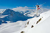 Skier jumping in front of the mountains, Montgenèvre, Alps, France