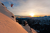 Skier jumping in front of the mountains, Montgenèvre, Alps, France