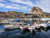 The harbour. The town Uummannaq in the northwest of Greenland, north of the polar circle. North America, Greenland, danish territory