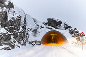 Tunnel to sommaroy, landscapes and dwellings amidst fjords and sharp alpine mountains. As the sun is not visible in winter, only the moon illuminates the landscape. Islands around Tromso, Norway,