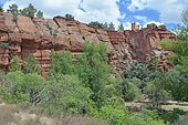 Rio Martin Nature and Cultural Reserve: red sandstone from the Triassic period. An ancient dovecote on the cliff (farmers used to raise pigeons for the protein they provided and the guano they spread in the fields, Province of Teruel, Spain).