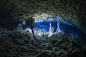 Cave diver in an underwater cave of karstic origin at a depth of 75 meters during the Gumbo La Baharini 2 expedition, which aimed to produce a complete 3D model of this karstic cave using photogrammetry. Passe Bateau Sud, Mayotte lagoon