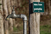 Water tap and 'non drinking water' sign, Sarthe, France