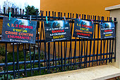 Display against global warming, poster "if the climate were a bank, they would have saved it!", "1 2 3 degrees is a crime against humanity" La France Insoumise, on railings. Le Mans, Sarthe, France