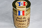 Glass jar of Miel de France, bottled in the Pyrenees, Michaud family, beekeepers since the 1920s, France