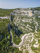 Aerial view of the Gorges de La Nesque, Rocher de Cire cliff (853 m) and road D 942 between Villes-sur-Auzon and Monieux, Mont Ventoux Regional Nature Park, Vaucluse, France