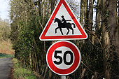 Warning horses" and "speed 50 km/h" road signs, Champagne, Sarthe, France