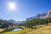 Lac des prés Soubeyrand or lac Miroir (2214 m) dominated by the Pics de la Font Sancte (3385 m) and the Crête des Veyrés (3000 m), Ceillac, Queyras Regional Nature Park, Hautes Alpes, France
