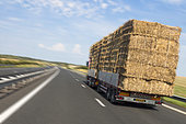 Straw transport by truck on the freeway, help after heatwave and drought, France