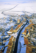 Aerial view of the village-street of Manhoué in the snow, Moselle, Lorrraine, France