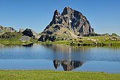 Pic du Midi d'Ossau reflected in the Lac d'Anayet: an ancient volcano dating from the Permian period (280 Ma). Aragonese Pyrenees, Spain