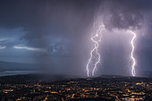 Thunderstorm and lightning near Annemasse. Multiple lightning strikes near Annemasse, Haute-Savoie, France, during a very active thunderstorm.,.