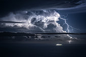 Thunderstorm in the Mediterranean, opposite San Remo, Liguria, Italy. Extra-cloudy lightning in a vigorous thunderstorm between Corsica and the mainland.