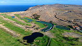 Aerial view of the Porto Santo's golf course, built in 2004 by the local government and the glf chamion Severiano Ballesteros, to promote tourism in the island, always short on water. The green is watered with waste water. Porto Santo Island. Madeira. Portugal.