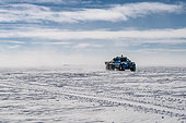 The Arctic Truck is a 6x6 vehicle designed for rapid passenger transport, mainly in the event of a medical emergency at the Beyond Epica drilling camp, located at Little Dome C (about 30 km from the Concordia station). Concordia Antarctic Research Station, Dome C plateau, East Antarctica.
