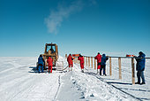 Installation of a new electrical cable on an overhead cable tray. Electrical cables outdoors are subject to significant temperature variations and ultra-violet rays, accelerating their ageing and requiring replacement after several years. Concordia Antarctic Research Station, Dome C plateau, East Antarctica.