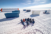 Photo of the team after the successful container transfer mission. On the surface, such a mission may seem straightforward, but it can be subject to a very wide and unlikely range of unforeseen events that could easily cause it to be cancelled. Little Dome C, Antarctic Plateau, Antarctica