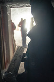 A scientist comes to retrieve an ice core stored in an underground cellar. These ice cores contain the climate archives of the past. These cores allow us to reconstruct the climate of the last 800,000 years. Concordia Antarctic Research Station, Dome C plateau, East Antarctica.
