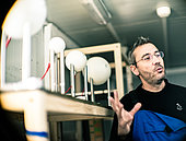 A scientist describes his experiment to the new winterers. Concordia Antarctic Research Station, Dome C plateau, East Antarctica.