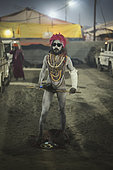 Kumbh Mela 2025: The Sacred Goes Viral. The Naga Sadhus: Guardians of the Kumbh Mela. At the Maha Kumbh Mela, the Naga Sadhus stand as powerful symbols of asceticism and strength. With their distinctive appearance, clad in nothing but ash, with dreadlocked hair and intense spiritual focus, they greet pilgrims with both grace and authority. As the faithful approach, offering their donations, the Naga Sadhus accept them not for material gain but as a reminder of the sacred cycle of giving. These ascetics, who have renounced all worldly attachments, embody the spirit of selflessness and spiritual devotion, welcoming the pilgrims in their journey to purification and enlightenment.