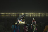 Kumbh Mela 2025: The Sacred Goes Viral. Crossing the Sacred Waters. Pilgrims on the Floating Bridges of the Kumbh Mela. As millions of pilgrims arrive at the Maha Kumbh Mela, the floating bridges serve as vital passages over the holy Ganges River. Walking across these makeshift structures, pilgrims are not just crossing water—they are crossing into a deeper spiritual realm. The path is lined with devotion, as each step brings them closer to purification and peace. These bridges, built to withstand the immense flow of people, represent both the physical and spiritual journeys that define the Kumbh Mela, where faith and resilience merge on the sacred waters.