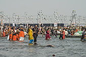 Kumbh Mela 2025: The Sacred Goes Viral. A Selfie on the Sacred Waters. An Individual Taking a Selfie on a Boat at the Kumbh Mela. On the waters of the Ganges, a couple takes a moment to capture a selfie, smiling as the sacred river flows beneath. The woman, amidst the vast spiritual gathering of the Kumbh Mela, uses his smartphone to preserve this personal moment while surrounded by the grandeur of the festival. This scene highlights the intersection of personal reflection and collective spirituality, where ancient rituals are met with modern technology. As he poses for the camera, the couple is not only commemorating his journey but also connecting with the larger experience of the Kumbh Mela, where faith and digital expression coexist.