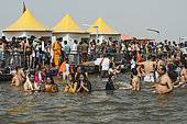 Kumbh Mela 2025: The Sacred Goes Viral. The Sacred Bath at the Sangam. At the Kumbh Mela, thousands of pilgrims gather at the Sangam, the sacred confluence of the Ganges, Yamuna, and the mythical Sarasvati rivers, to perform the ancient ritual of the sacred bath. The water, believed to purify the soul and wash away sins, is a central part of this spiritual journey. As the pilgrims immerse themselves in the holy waters, they are united in their devotion and faith, embodying the collective spirit of the festival. The sacred bath is more than just a physical cleansing, it is a moment of spiritual awakening, a renewal of faith, and a step toward liberation. The scene is filled with a sense of serenity and reverence, as people from all walks of life come together in this timeless act of devotion.