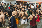 Kumbh Mela 2025: The Sacred Goes Viral. Capturing the Sacred Moment. Pilgrims Taking a Picture During the Sacred Bath. A group of pilgrims, united by their faith, take a moment to capture a selfie during the sacred bath at the Kumbh Mela. With the holy waters of the Ganges flowing around them, they smile and pose for the camera, immortalizing the experience on their smartphones. This image beautifully juxtaposes the timeless spiritual significance of the bath with the contemporary desire to document the moment. The scene highlights how the younger generation engages with ancient traditions through the lens of modern technology, while still embracing the deeply rooted rituals that have defined the Kumbh Mela for centuries. The selfie becomes a bridge between personal memories and the collective spiritual journey of millions.