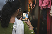 Kumbh Mela 2025: The Sacred Goes Viral. Capturing Sacred Moments. In the midst of the spiritual fervor at the Maha Kumbh Mela, the sacred tents of the Naga Sadhus become not only a symbol of asceticism but also a modern-day attraction. Pilgrims, with their smartphones in hand, pause to capture the moment, blending ancient spirituality with contemporary expression. As the Naga Sadhus remain focused on their spiritual journey, the pilgrims share their experiences in real time, allowing the sacred event to transcend physical boundaries. This fusion of devotion and digital documentation reflects the evolving nature of pilgrimage, where faith and modern technology coexist.