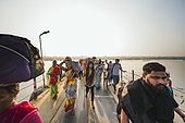 Kumbh Mela 2025: The Sacred Goes Viral. Pilgrims and Sadhus Crossing the Floating Bridges Together. Pilgrims and Sadhus Walking Across the Floating Bridges at the Kumbh Mela. At the Kumbh Mela, pilgrims and sadhus move in unison across the floating bridges that span the sacred river. As they cross, the bridge becomes a symbolic pathway for both physical and spiritual journeys. The sadhus, with their ascetic lifestyle and spiritual presence, guide and inspire the pilgrims as they pass over the holy waters of the Ganges, Yamuna, and Sarasvati. The image captures the unity of different groups, each with their unique journey, yet all coming together in shared devotion. The crossing of the floating bridges represents not only a connection to the river’s spiritual power but also the collective spirit of the Kumbh Mela, where faith, humility, and community are intertwined.