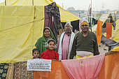 Kumbh Mela 2025: The Sacred Goes Viral. Faith and Reality. Beyond the Rituals: Life on the Margins of the Kumbh Mela. While millions of pilgrims come to the Maha Kumbh Mela seeking spiritual purification, life on the riverbanks tells another story. Amidst the grand rituals and sacred waters, families build temporary shelters, and children navigate the daily realities of survival. This image captures the contrast between faith and hardship, showing that while the Kumbh Mela is a place of devotion, it is also a space where resilience, community, and the struggle for a better life unfold side by side.