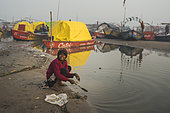 Kumbh Mela 2025: The Sacred Goes Viral. Faith and Reality. Beyond the Rituals: Life on the Margins of the Kumbh Mela. While millions of pilgrims come to the Maha Kumbh Mela seeking spiritual purification, life on the riverbanks tells another story. Amidst the grand rituals and sacred waters, families build temporary shelters, and children navigate the daily realities of survival. This image captures the contrast between faith and hardship, showing that while the Kumbh Mela is a place of devotion, it is also a space where resilience, community, and the struggle for a better life unfold side by side.