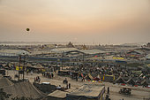 Kumbh Mela 2025: The Sacred Goes Viral. The Twilight of the Kumbh Mela. Tents and Pilgrims at Sunset. As the sun sets over the Kumbh Mela, the vast array of temporary tents sprawls across the sacred grounds, creating a sea of color and life. The fading light casts long shadows, highlighting the bustling pilgrimage that continues long after the sun dips below the horizon. These tents, symbolic of the temporary nature of the festival, offer a place of rest and reflection for millions. In this moment of stillness, as the golden hues of sunset paint the sky, the Kumbh Mela transforms into a peaceful sanctuary, a reminder of the spiritual journey that brings pilgrims from all over the world.