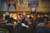 Kumbh Mela 2025: The Sacred Goes Viral. Capturing Sacred Moments. In the midst of the spiritual fervor at the Maha Kumbh Mela, the sacred tents of the Naga Sadhus become not only a symbol of asceticism but also a modern-day attraction. Pilgrims, with their smartphones in hand, pause to capture the moment, blending ancient spirituality with contemporary expression. As the Naga Sadhus remain focused on their spiritual journey, the pilgrims share their experiences in real time, allowing the sacred event to transcend physical boundaries. This fusion of devotion and digital documentation reflects the evolving nature of pilgrimage, where faith and modern technology coexist.
