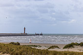 Sailboat on the beach at Dunkirk, with the St Pol Fire in the background, Nord, France