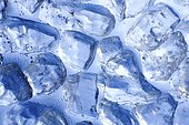 Macro of ice cubes in a blue bin