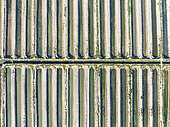 Saline ponds at the salt works of Isla Cristina. Aerial view. Drone shot. Huelva province, Andalusia, Spain.